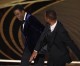 Will Smith slaps Chris Rock in the middle of Oscars presentation